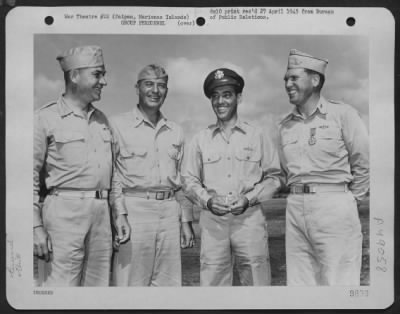 Groups > Colonel Lewis M. Sanders Of Chicago, Illinois, Commanding Officer Of The 318Th Fighter Group, Poses With His Superiors After Receiving The Legion Of Merit From Brig. General Thomas J. Cushman, Usmc, Commanding General Of The Saipan Air Defense Command, At