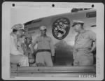 Thumbnail for Men Chatting Together Are, Left To Right: Colonel Birrell Walsh, Chief Of Staff Of 313Th Bomb Wing (Vh), Colonel John H. Davies, Commanding Officer Of The 313Th Bomb Wing (Vh), Capt. P. J. Halloran, Usn, Chief Island Engineer, And Brig. General Frederick - Page 1