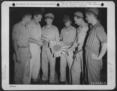 Groups > 7Th Air Force Men Holding A Captured Japanese Flag. Pacific.