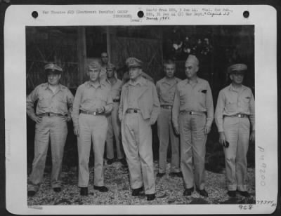 Groups > General Douglas Macarthur, Commander-In-Chief Of The Allied Forces In The Southwest Pacific Area, Photographed With Some Of His Landing Officers On An Island In The Southwest Pacific During The Generals Visit To American Troops, Who Immediately Afterward