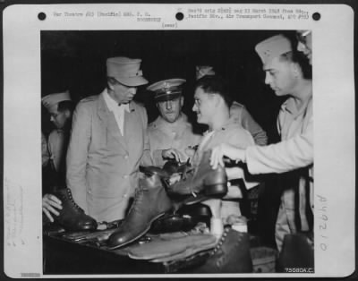 Thumbnail for Groups > During Her Tour Of The Pacific Area Mrs. F. D. Roosevelt Is Shown Size 19 1/2 Shoes At The Cobbler Shop At Noumea, New Caledonia Islands, 1943.