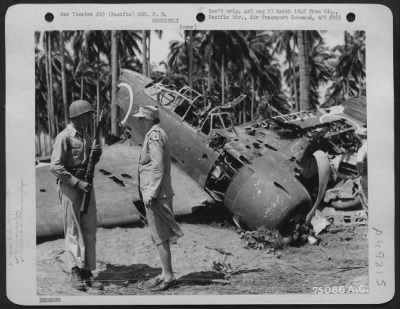 Thumbnail for Groups > During Her Tour Of The Pacific Area Mrs. F. D. Roosevelt Chats With Pvt. Clarence D. Robertson From Tulsa, Okla, Who Guards A Wrecked Jap Zero At Guadalcanal, Solomon Islands, 1943.