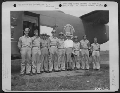 Thumbnail for Groups > Mrs. F. D. Roosevelt Poses With The Crew Of The Plane That Took Her From Base To Base On Her Visit In The Pacific Area In 1943. Left To Right Are: S/Sgt. Evans F. Houghton; M/Sgt. Long; Major George E. Durno; Capt Arroldus; Capt. Pickering; Mrs. Roosevelt