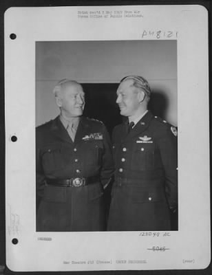 Groups > Commanders Of The U.S. Air-Ground Team That Relieved Bastogne Discuss Plans For Operations Against Von Rundstedt'S Armies In Belgium.  Brig. General Otto P. Weyland, Right, Commands The Xix Tacticl Air Command Of The Ninth Air Force, The Air Component Pla