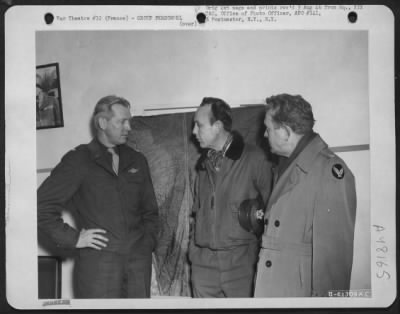 Groups > France. Brigadier General Otto P. Weyland, Left, Commanding General Of The Xix Tactical Air Command, Explains The Decisive Role Played By Ninth Air Force Fighter-Bombers In Halting Von Rundstedt'S Counter-Offensive, To A Pair Of Interested Listeners, Will