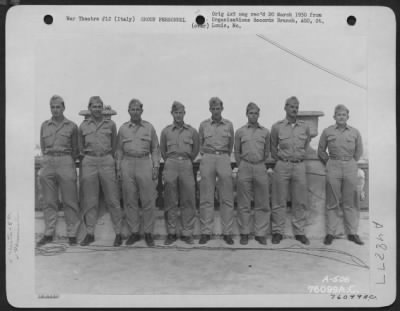 Thumbnail for Groups > Major Mc Clearnon Poses With Officers Of The 5Th Photographic Reconnaissance Squadron At An Air Base Somewhere In Italy.