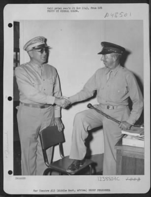 Thumbnail for Groups > Middle East Air Depot:  Lt. Colonel Robert M. Baughey, 1002 'O' St. Sacramento, Calif., Executive Officer At A Middle East Air Depot Under The 9Th Air Service Command, Greets Brig. General G.X. Cheves, Chief Of Staff, United States Army Forces In The Midd