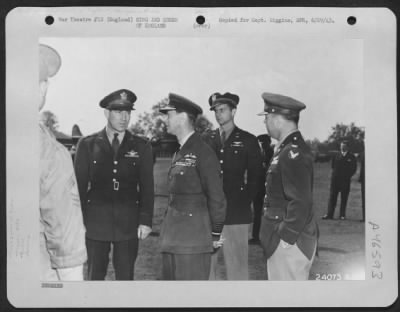 Thumbnail for King and Queen of England > King George of England talks with high American Army officers during a visit to an Eighth Air force base to inspect the crew of the "Memphis Belle," famed Boeing B-17 Flying ofrtress.