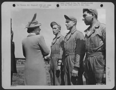 Thumbnail for King and Queen of England > Her Majesty, The Queen Of England In Her Usual Charming Manner, Stops To Chat With Three Members Of A Ground Crew When She And The King Made A Tour Of Inspection Of The American Bomber Station In England.  Basingbourne, England. May 1943