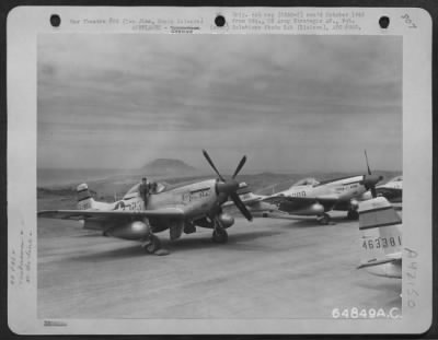 Thumbnail for North American > Two North American P-51 Mustangs 'Tiny Gay Babe' & 'Three Of A Kind' On Parking Area, Iwo Jima, Bonin Islands. [21St Fighter Group, 72Nd Squadron, 1945]