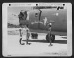 Thumbnail for Natives Stand Beside The Consolidated B-24 'Miss Bee Haven.'  Nanumea Island, Ellice Islands, 14 December 1943. - Page 1