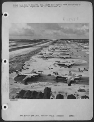 Thumbnail for Consolidated > Squatting In Their Dispersal Area At North Field, Guam, (Marianas Group) Are Planes Of The 29Th Bomb Group, 314Th Wing.  This View, Looking East, Shows Part Of The Southwestern Area Of North Field.  The 19Th B.G.'S B-29'S Are Located In The Background.