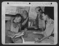 Thumbnail for Marianas Group -- Showing 7Th Aaf Bomber Crewmen What To Expect On Their Way To The Target, Lt. William Troutman, Elizabeth, Pa., Oceanographer, And Forecaster, Goes Over Maps And Charts In An Advanced 'Weather Central' Tent. Map In The Foreground Shows L - Page 1