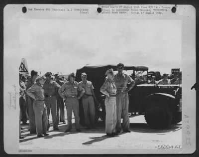 Thumbnail for Consolidated > Hiroshima Atomic Bomb Crew.  (No. 4 Of Seven Pictures.)  General Spaatz And Staff, Together With Rear Admiral W.R. Purnell, Brig. Gen. Thomas F. Farrell, Await The Officers And Crew Of The Enola Gay At A Base In The Marianas.