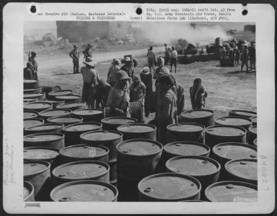 Thumbnail for Consolidated > Japanese Soliders And Civilian Prisoners Of War Rolling And Stacking Gasoline Drums At A Supply Dump On Saipan, Marianas Islands.  29 June 1944.