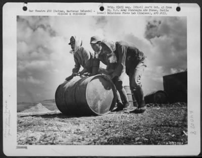 Thumbnail for Consolidated > Japanese Soliders And Civilian Prisoners Of War Rolling And Stacking Gasoline Drums At A Supply Dump On Saipan, Marianas Islands.  29 June 1944.