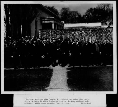 1928 > President Coolidge with Charles A Lindbergh and other dignitaries