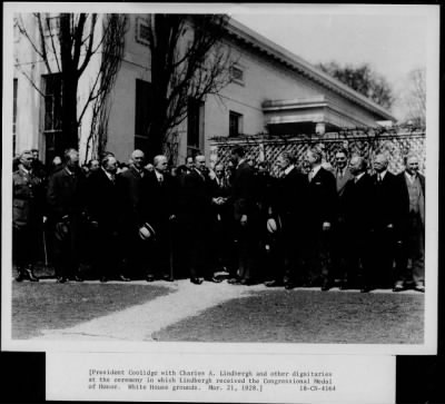 1928 > President Coolidge with Charles A Lindbergh and other dignitaries