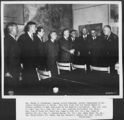 1945 > Congressman at advance headquarters to witness Nazi atrocities