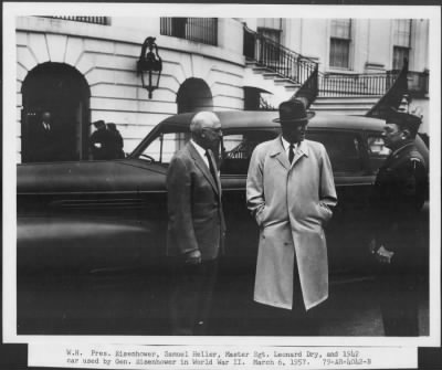 1957 > Samuel Heller and Master Sgt. L. Dry with 1942 car used in WW II