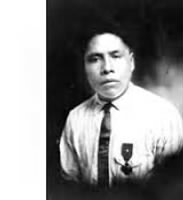 Joseph Oklahombi in tie with medal.png