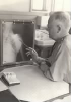 Thumbnail for Wilford E. Martyn looking at X-ray image.jpeg