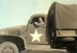 Thumbnail for Dad in army truck.jpg