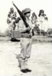 Thumbnail for Dad in uniform with rifle and helmet.jpg