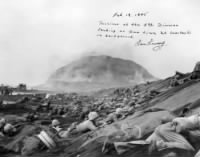 Thumbnail for Iwo Jima 19Feb1945 Samuel Bernstein facing camera above rope.jpg