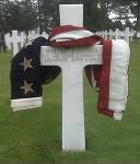 2008 photo of Walter Dobek's grave at the Normandy American Cemetery draped with the flag presented to his family after his funeral (Courtesy of the Wyszynski family).jpg