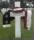 2008 photo of Walter Dobek's grave at the Normandy American Cemetery draped with the flag presented to his family after his funeral (Courtesy of the Wyszynski family).jpg