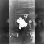 Edward Phillips holding his great-grandson Grover C. Phillips Jr.