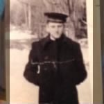 HOPKINS-Tom Gray holds a picture of his cousin, Edwin Hopkins, who died during the attack on Pearl Harbor, Dec.7, 1941.jpg