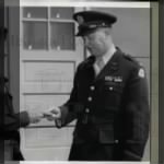 Lt Col KM Pattee turns keys to Camp Ellis over to Basil Spalding.jpg