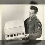 My Father in WWII with a Combat Piano used to rehab the wounded.